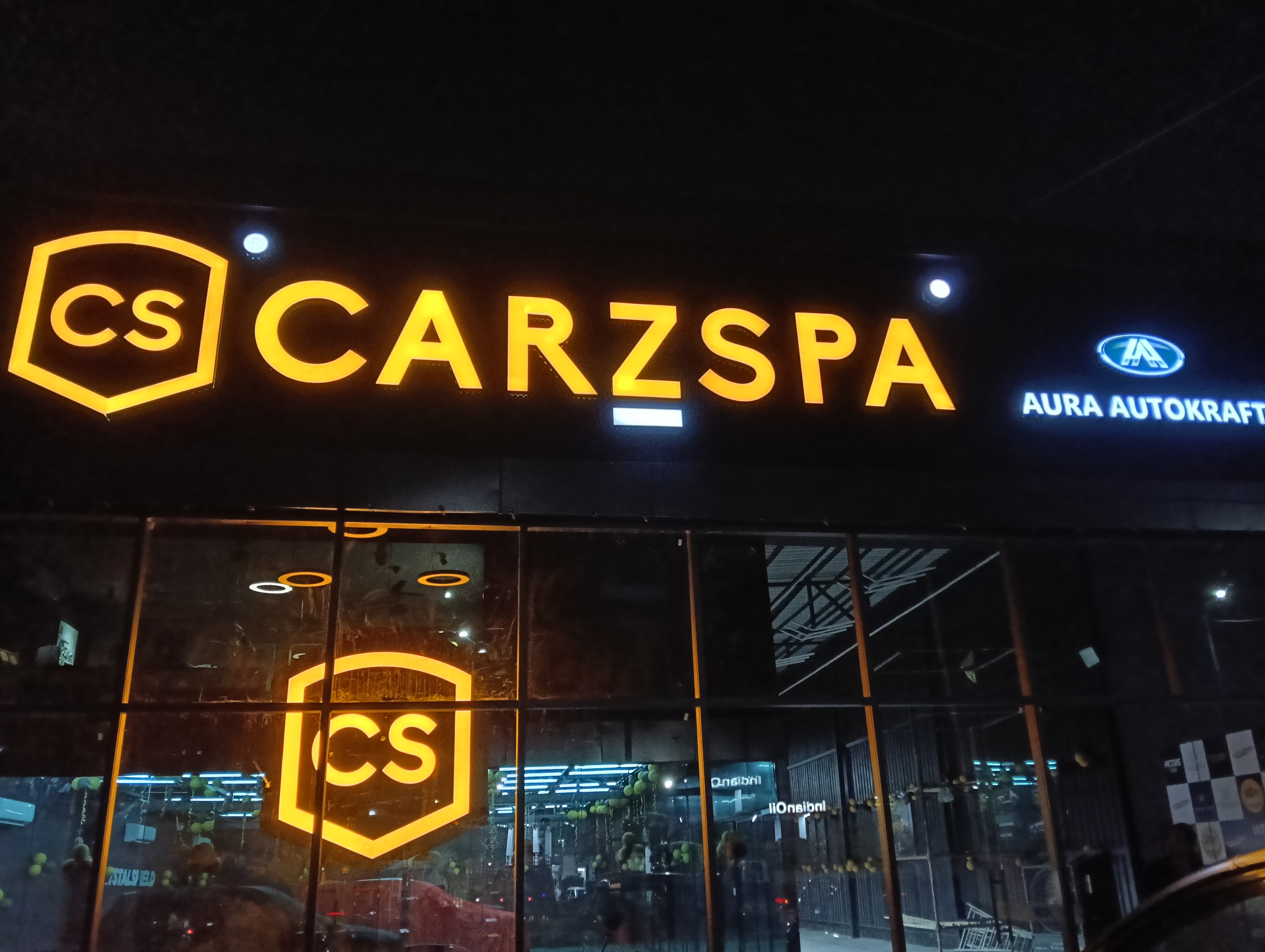 Illuminated storefront signage at night